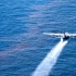 A C-130 Applies Dispersants During the BP Deepwater Horizon Oil Spill (USCG Photo)